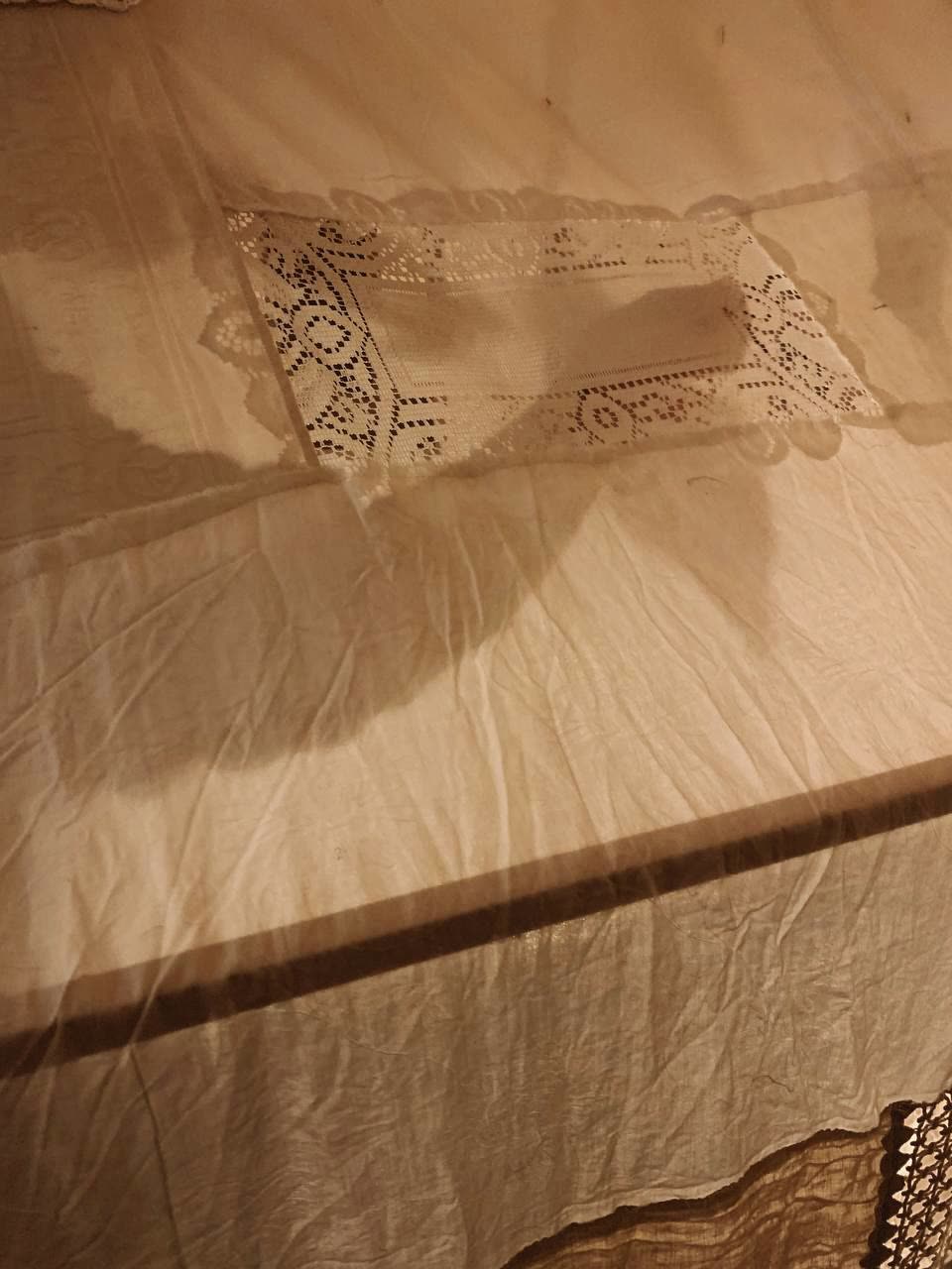 Lace swatch sewn into linen