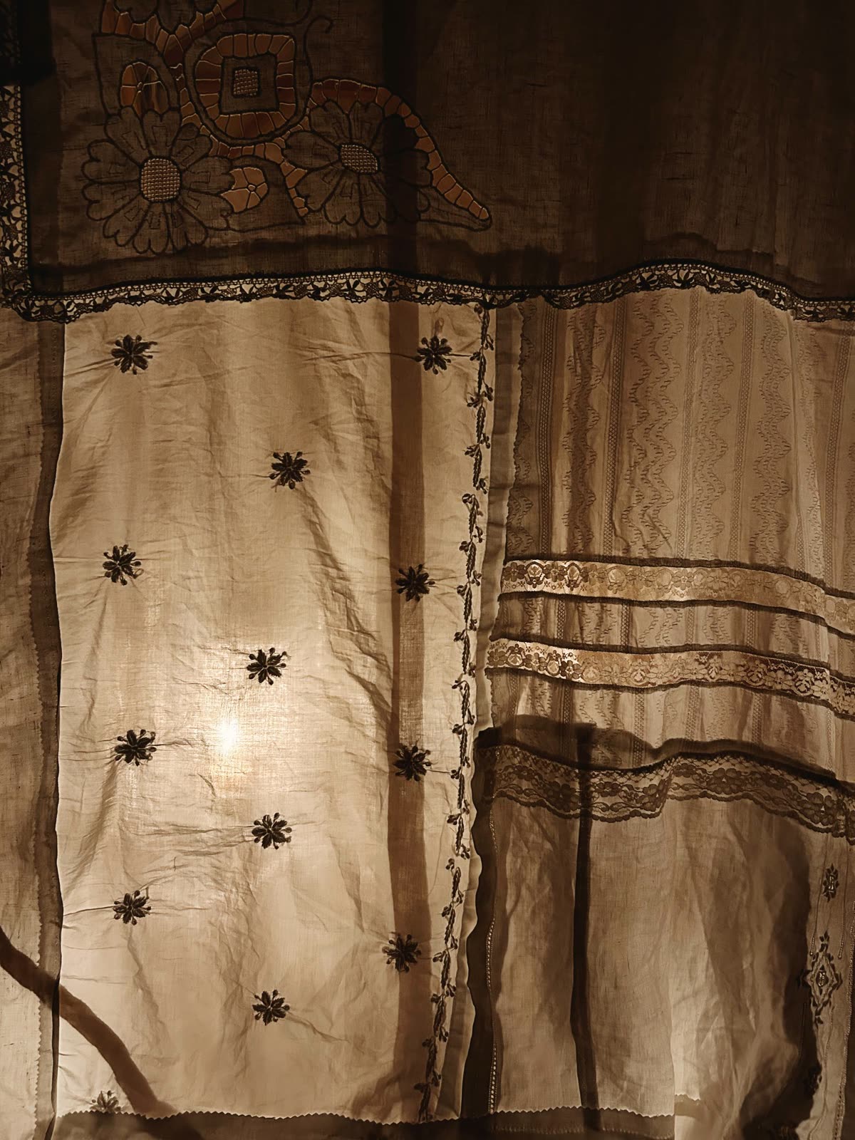 Patchwork of vintage fabrics glowing from inside